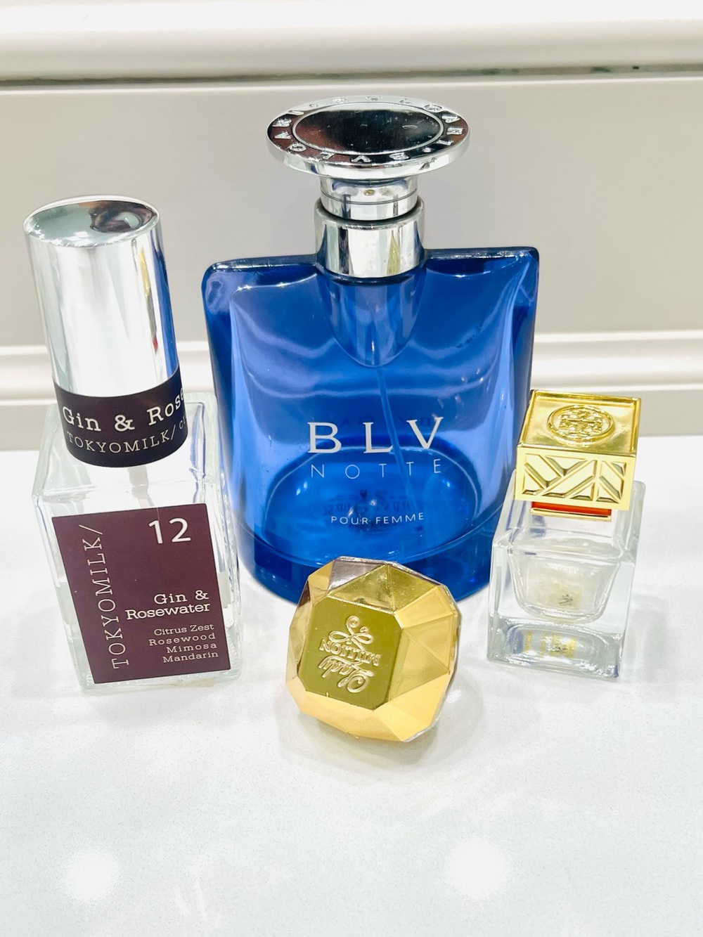 4 Perfume Bottles w/BVLGARI, Tory Burch, Lady Million